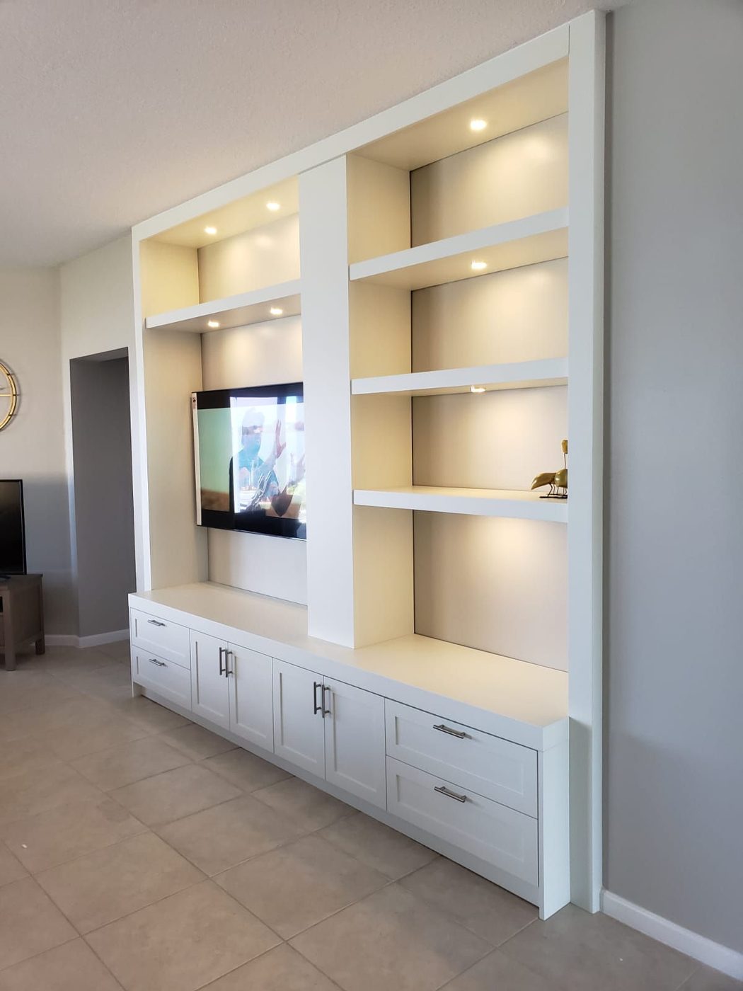 Custom built-in living-room shelving with integrated lighting