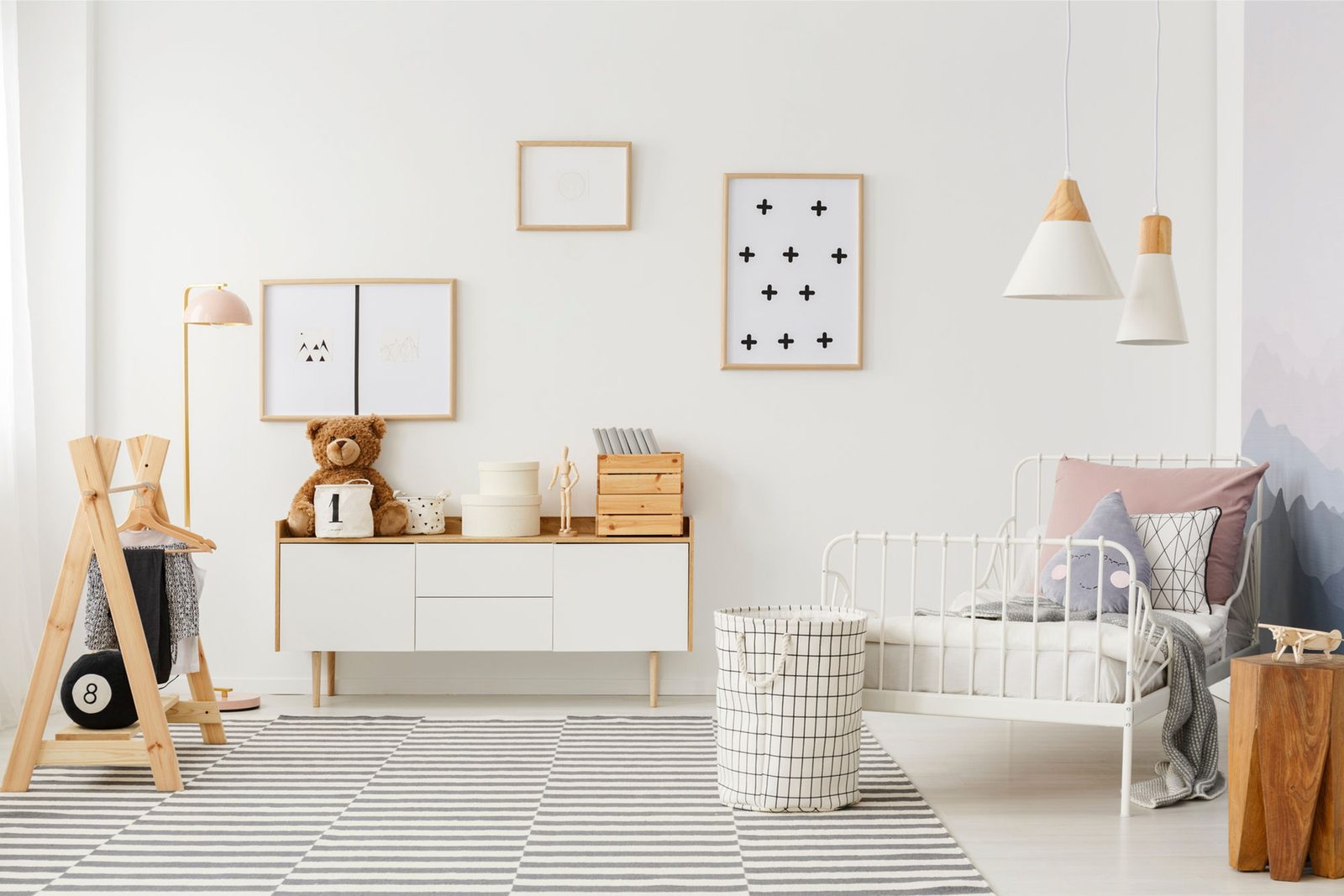 Designed bedroom with styled shelving and a soft palette