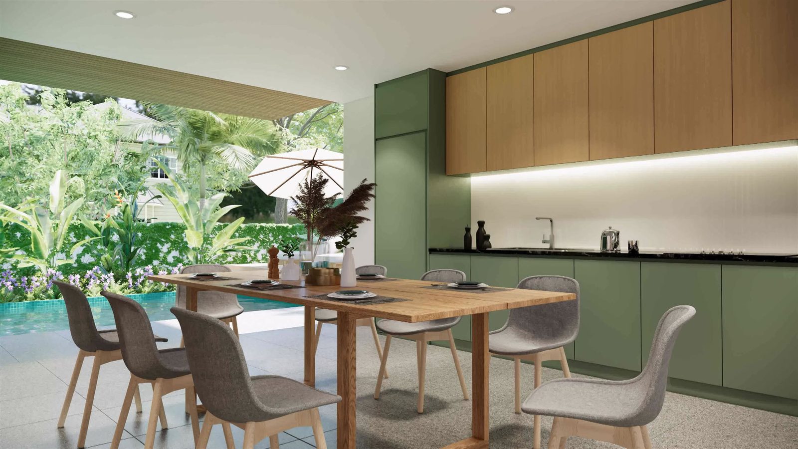 Kitchen with green cabinetry opening onto a garden and pool