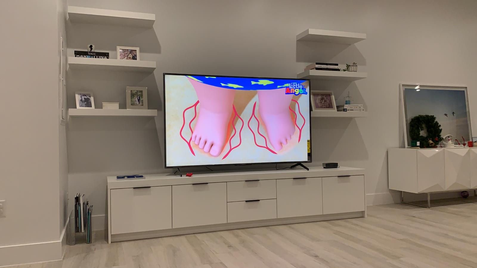 Custom media wall built-in with floating shelves